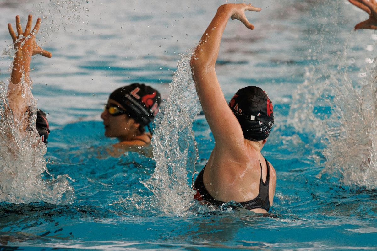 Artistic swimmers in formation