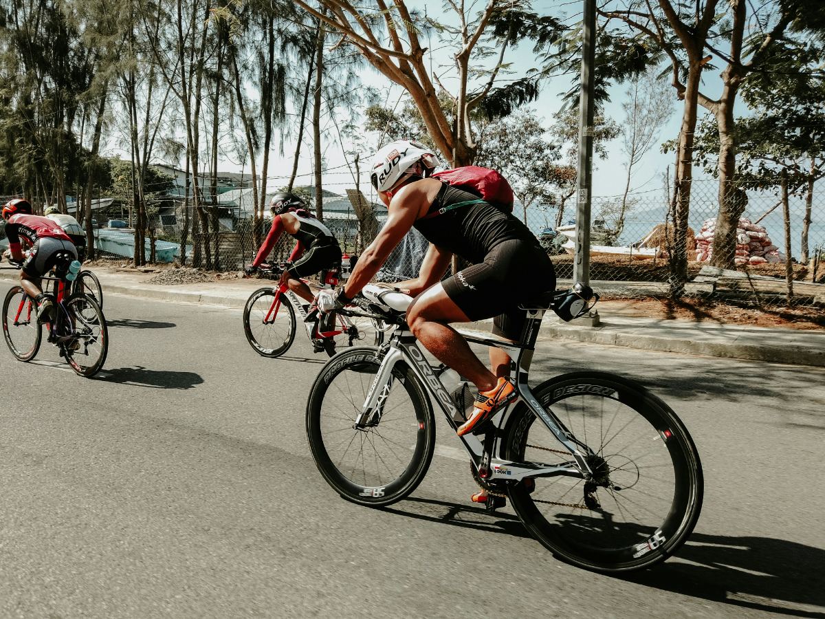 Triathletes riding coastal roads